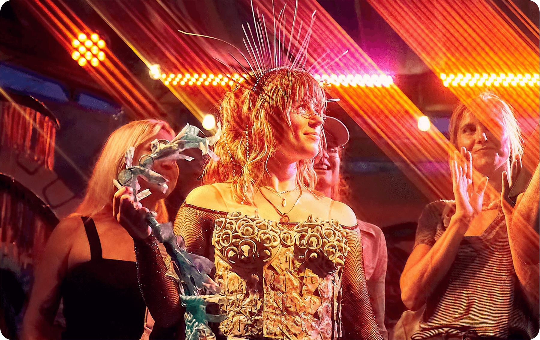 People at a party with colorful lights and decorations