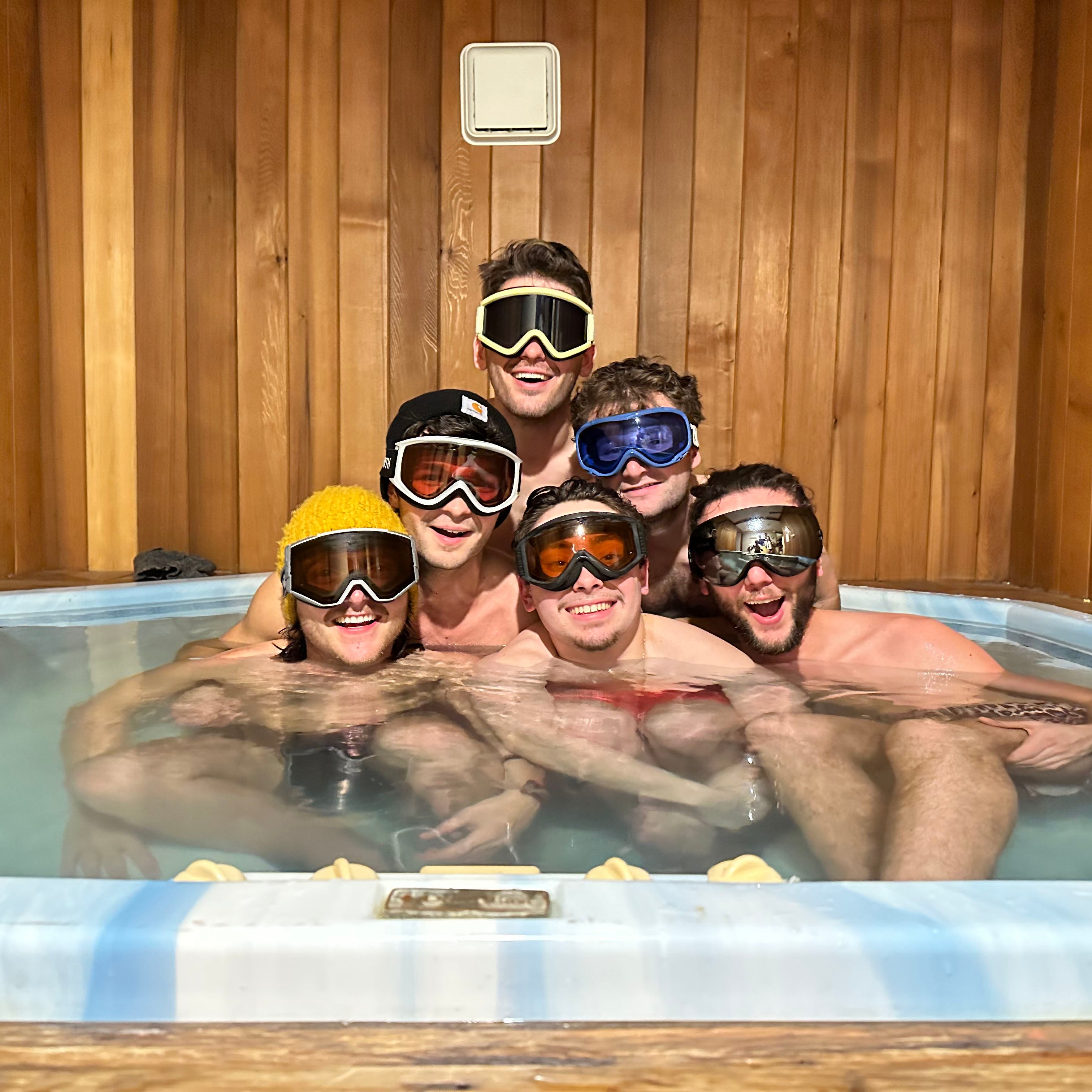 Image of Guess Method - a ONE on Stage band. Four people in hot tub wearing ski goggles. 