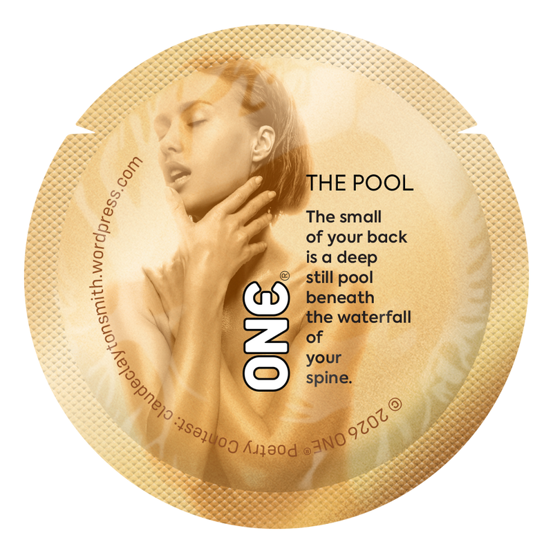 Gold condom wrapper featuring a lyrical poem about the curve of the lower back, evoking calm and closeness.