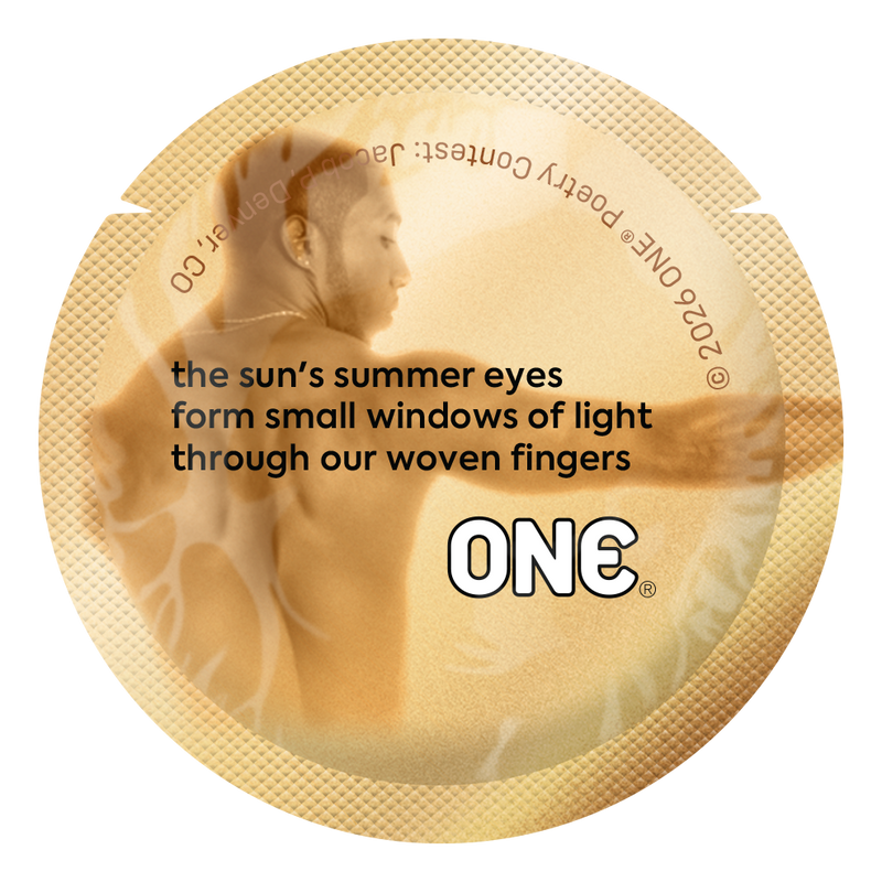Gold condom wrapper displaying a minimalist poem about sunlight, connection, and intimacy, printed in elegant typography.