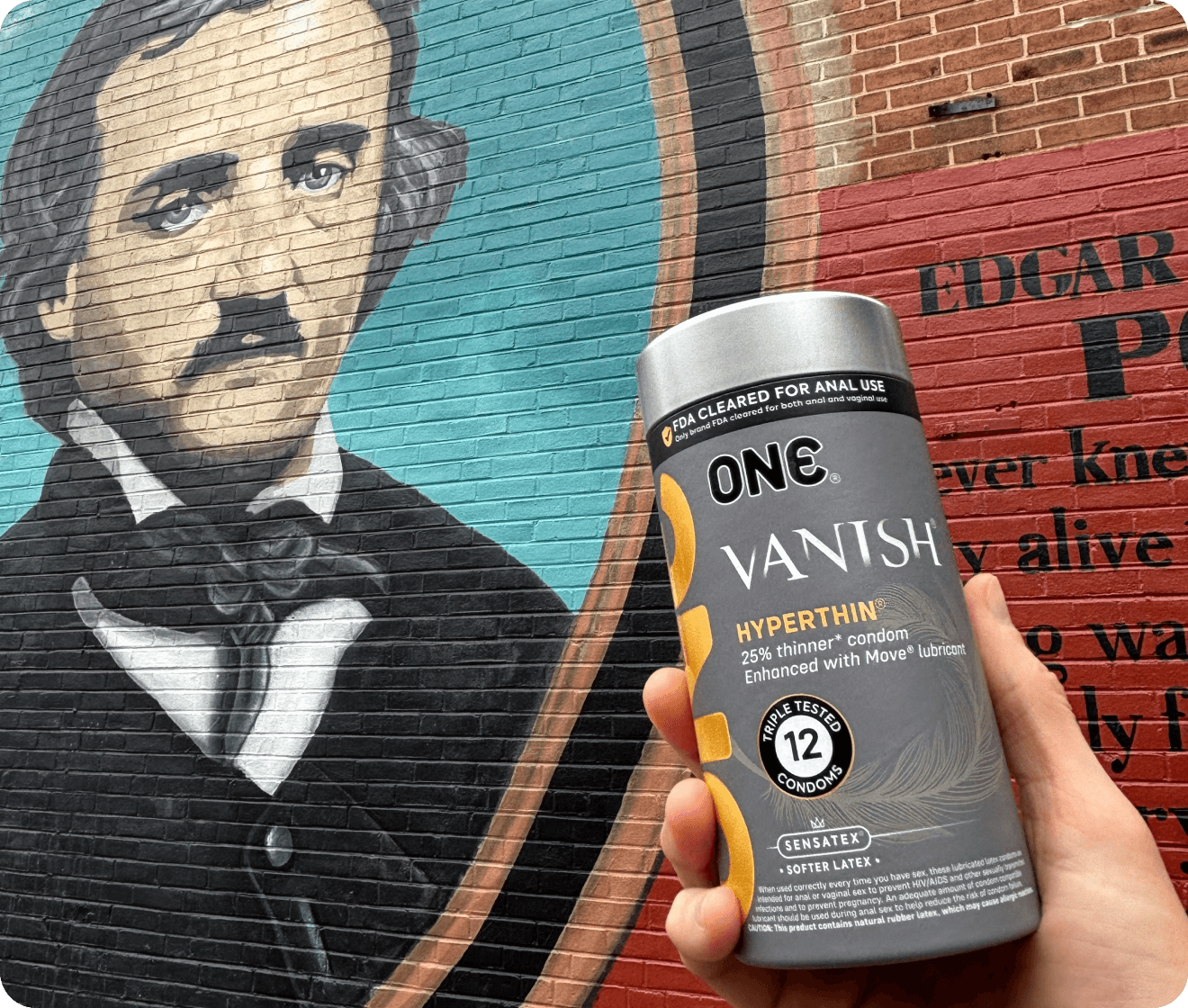 one condom case with edgar allen poe graffiti wall background
